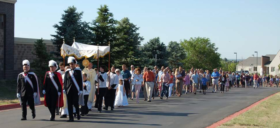 Corpus Christi Procession with First Holy Communion kiddos & Color Corps leading.